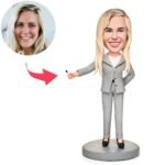 Teacher bobblehead pointing at blackboard