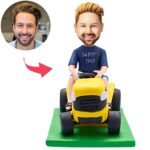 Super Dad bobblehead driving a car