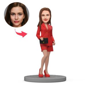 Female boss bobblehead in red suit with handbag