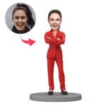Businesswoman bobblehead in red suit