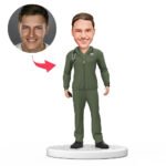 male doctor bobblehead in green scrubs