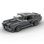 Grey brick-built classic muscle car model with detailed headlights and sporty design on a plain background