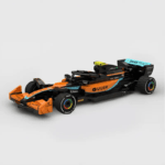 Formula 1 style racing car building blocks model in orange and black with detailed design and sponsor decals on a clean background