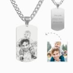 Custom photo dog tag necklace with engraved sketch of a father and child, plus back engraving “love you always have, always will,” shown with original photo