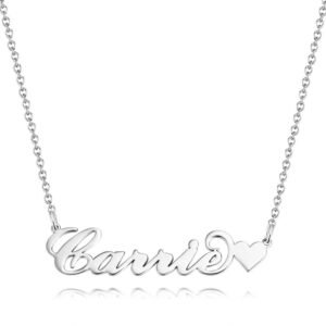 Personalized silver name necklace with “Carrie” in script and a small heart charm, on a delicate chain against a white background