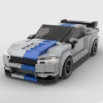 Grey brick-built sports car model with blue racing stripe and rear spoiler on a plain background