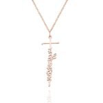 A rose gold necklace featuring a cross-shaped pendant with a vertical script name integrated into the cross design, hanging from a fine chain