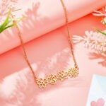 gold necklace with floral accents