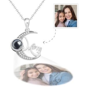 TYNL1282jpg - Printshop4me.au Custom necklace pendant in silver spelling 'Mom' with crescent moon and black projection stone, showing a projected photo of a smiling mother and daughter, alongside a small reference photo of them