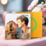 Personalized custom photo music plaque featuring a couple kissing on a beach, displayed in a Spotify-style music player design for the song “Beautiful” by Giulio Cercato. The top text reads “David 💖 Jenny.” The interface includes playback controls, a progress bar, and a heart icon. The plaque has a yellow border with a green circular record-style panel in the background, set in a soft floral and romantic studio scene.