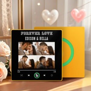 Personalized custom photo music plaque titled “FOREVER LOVE – EDISON & BELLA” featuring a collage of romantic couple photos arranged in a grid. The design appears on a black Spotify-style music interface with playback controls, progress bar, and a green circular record element. The plaque has a yellow border and is displayed in a warm indoor setting with decorative heart ornaments and soft floral accents.