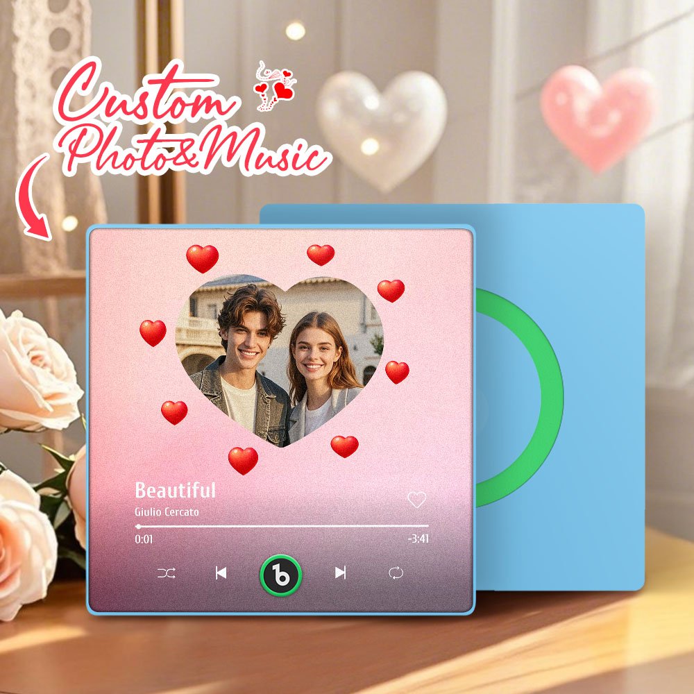 BXT0P744X16jpg - Printshop4me.au Personalized custom photo and music plaque featuring a couple’s photo inside a heart-shaped frame on a soft pink gradient background, surrounded by floating red heart icons. The design displays the song “Beautiful” by Giulio Cercato in a music code-style music player interface with playback controls and progress bar. The top includes the text “Custom Photo & Music.” A second blue panel with a green circular record-style design is placed behind the plaque in a romantic indoor setting.