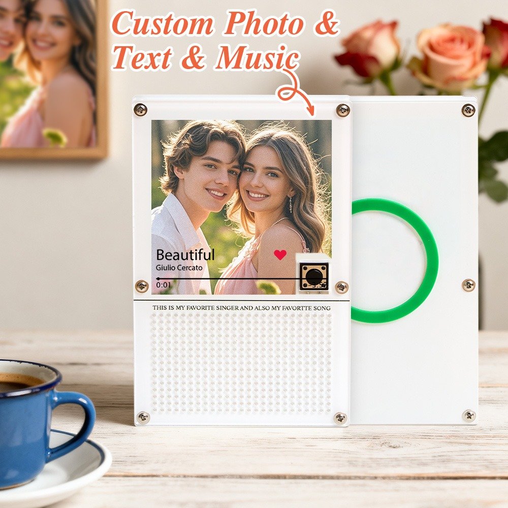 TOKBXT0P1485X02jpg - Printshop4me.au Personalized custom photo, text, and music acrylic plaque featuring a smiling couple photo displayed in a Spotify-style music player design for the song “Beautiful” by Giulio Cercato. The plaque includes a red heart icon, playback controls, and a printed message section reading “THIS IS MY FAVORITE SINGER AND ALSO MY FAVORITE SONG.” The design is shown alongside a second white panel with a green circular record element, placed on a wooden desk with a coffee cup and a soft floral background.
