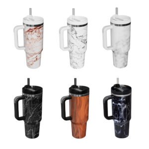 Row of six insulated travel mugs/tumblers with lids and straws, showcasing different marble and texture finishes including white, red-veined marble, grey marble, black marble, wood grain, and dark lightning-style patterns, displayed on a clean white background in a product lineup style.