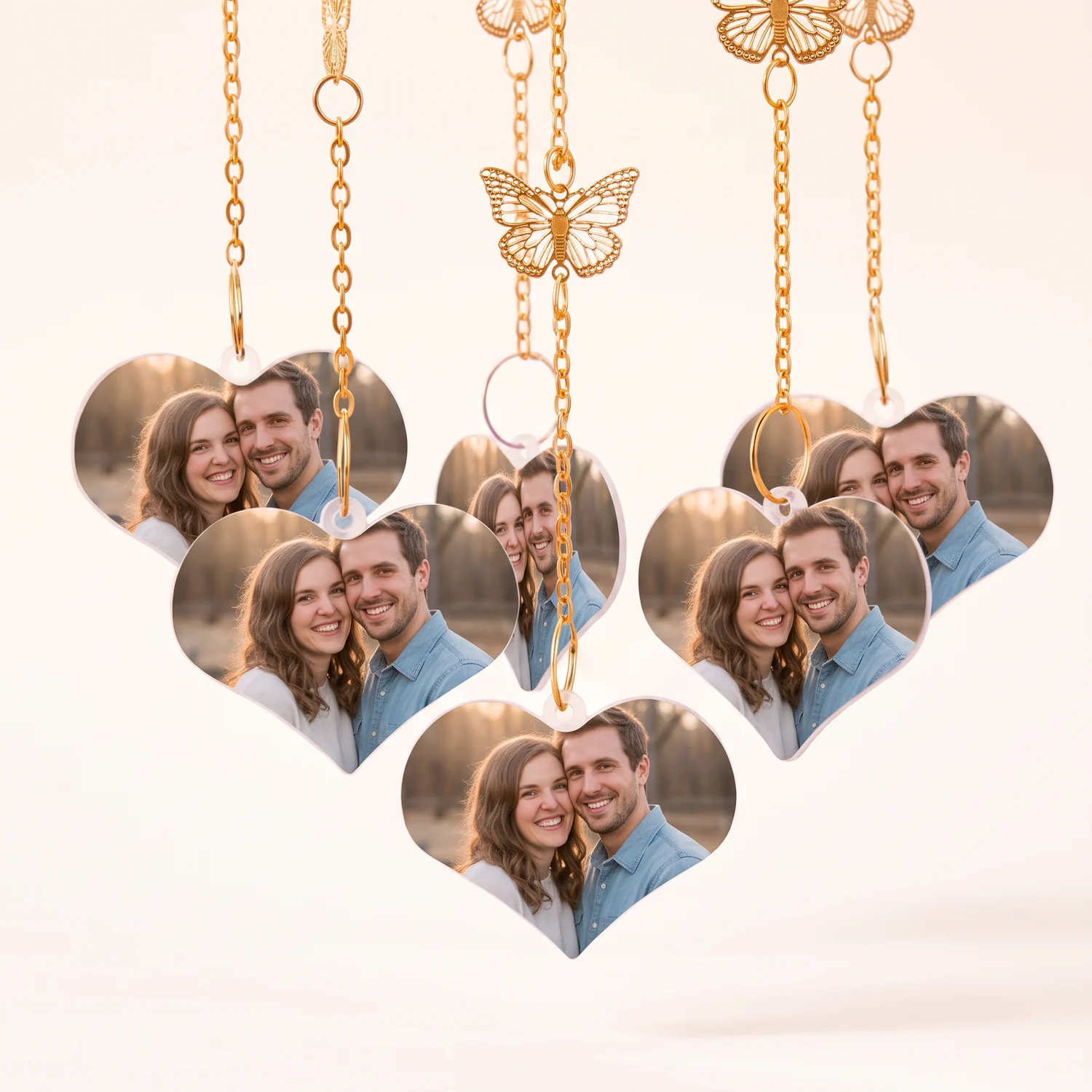Close-up of heart photo charms and butterflies on a wind chime